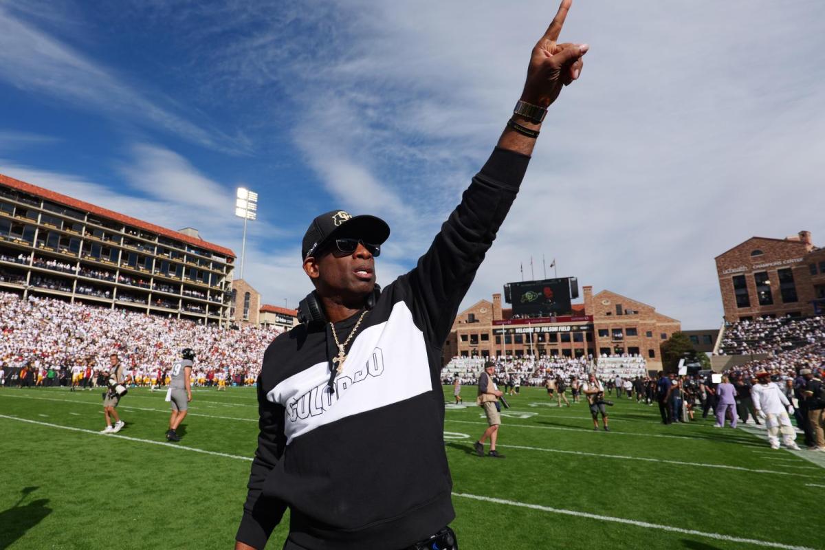 Deion Sanders pointing at Folsom Field crowd