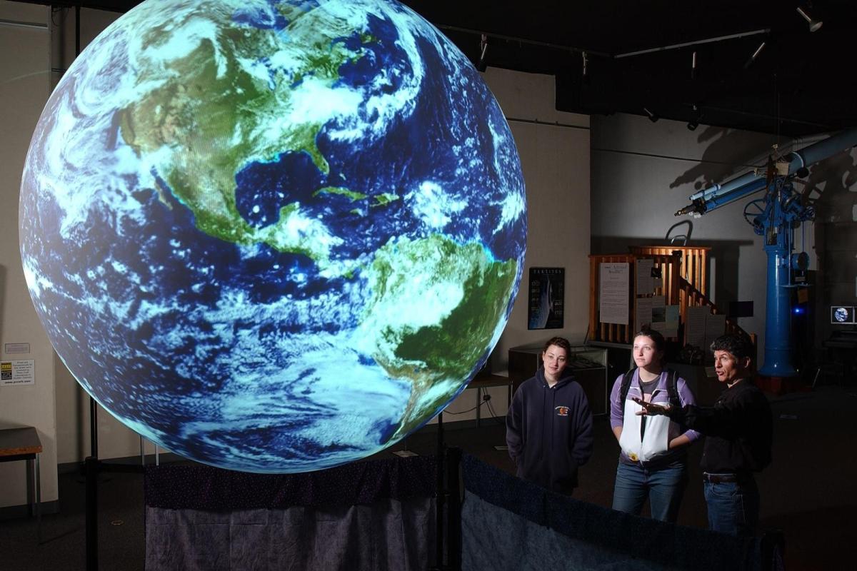 People looking at Earth