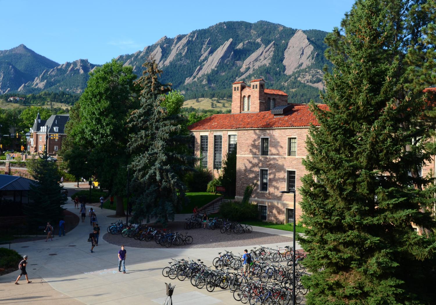 A view of Hellems Hall with the Flatirons behind