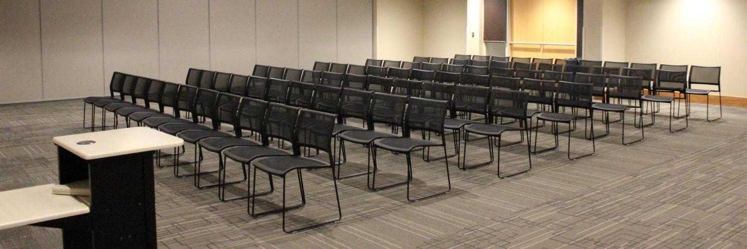 Kittredge Multipurpose room set with rows of chairs facing podium