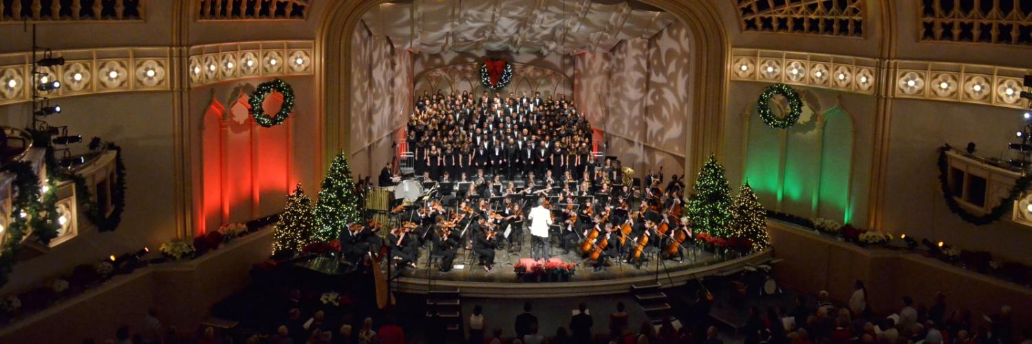 Macky Auditorium with holiday orchestra and choir