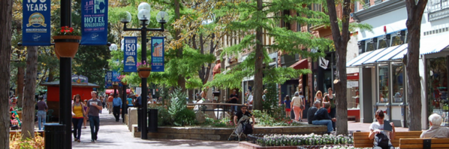 Pearl Street pedestrian mall with shops, benches, flower, trees, people