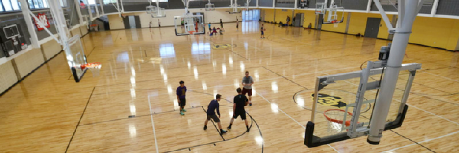 Rec Center basketball court with people playing a game
