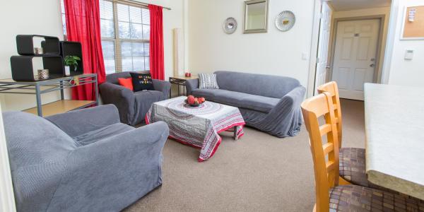 Bear Creek living room with sofa, chairs, coffee and side tables, window