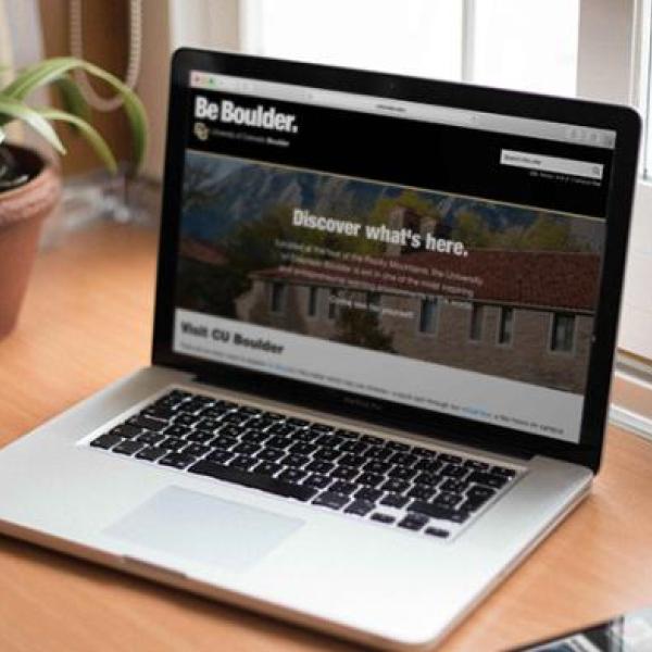 A macbook showing a CU website