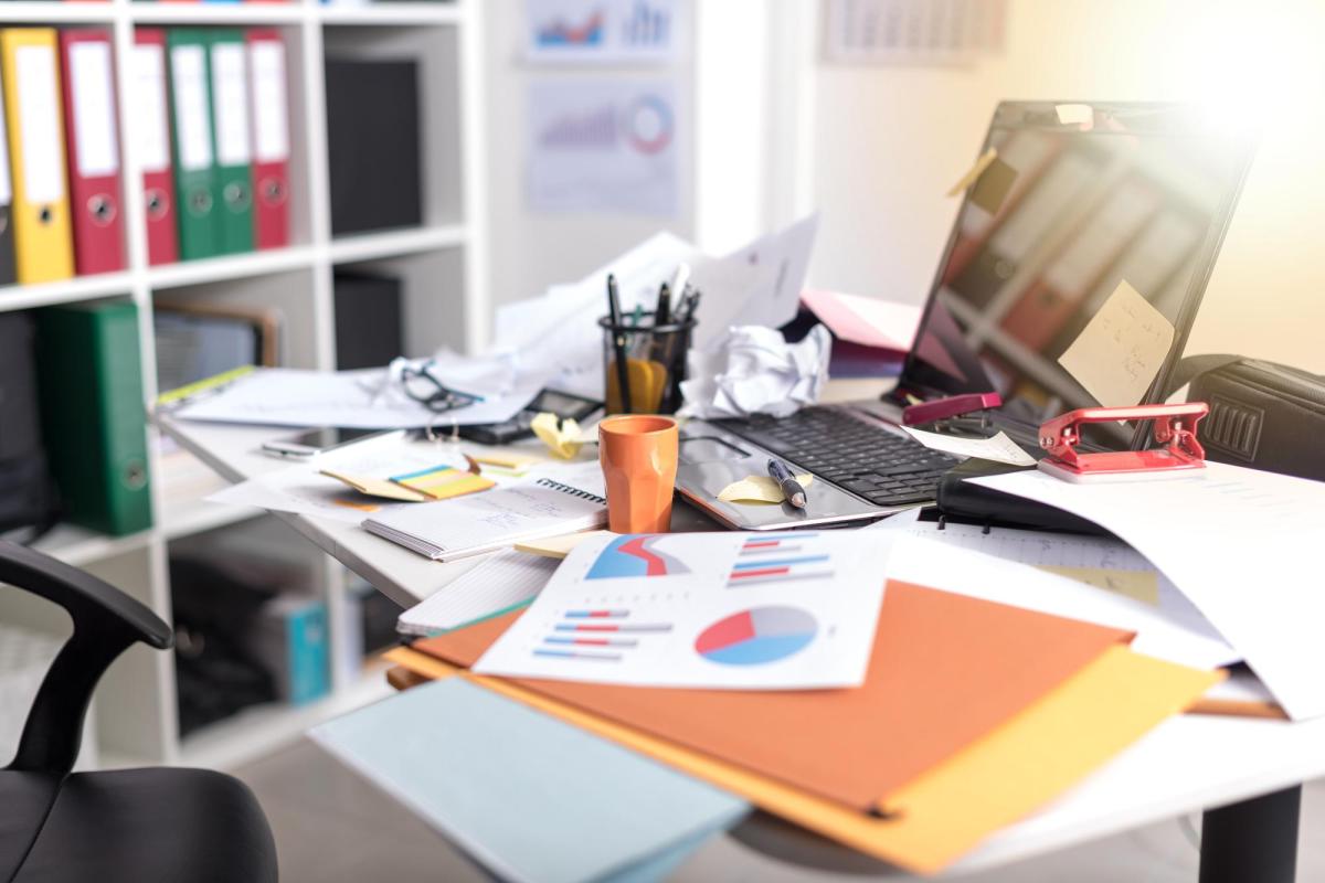 Photo of a disorganized desk.
