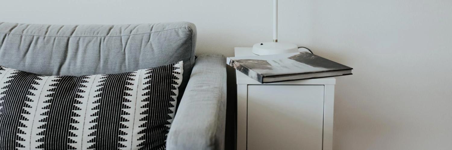 Photo of a couch and side table.