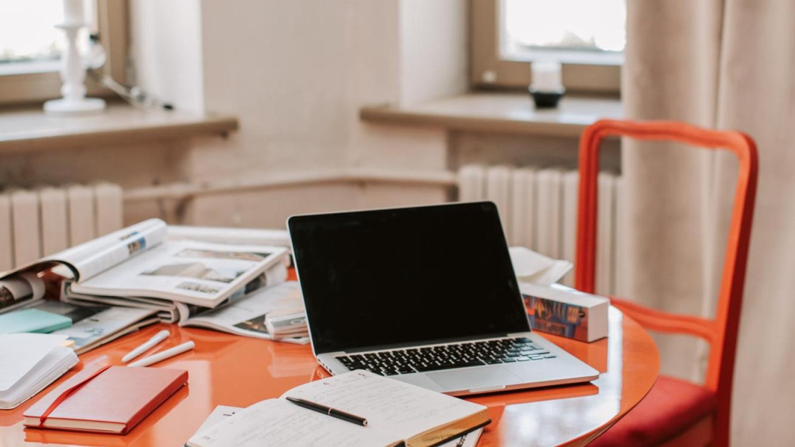table with books and laptop