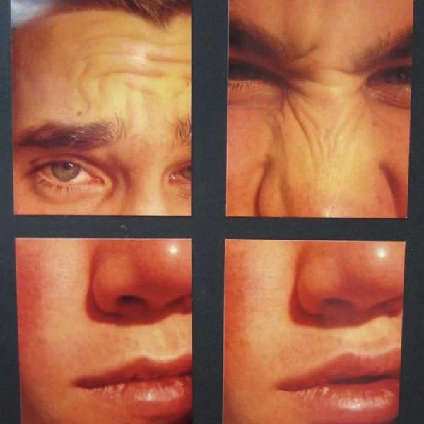 a collection of four pictures of a male face put together to create a portrait