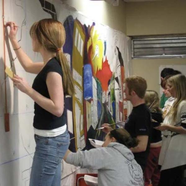 Photo of students painting mural