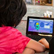 kids playing app on computer screen 