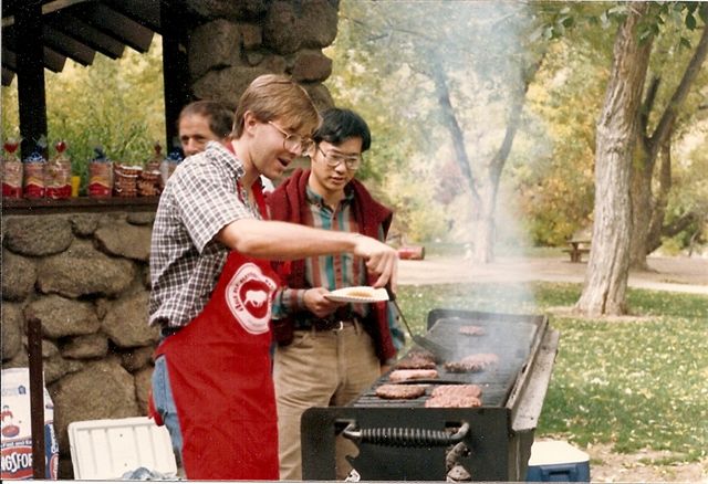 Adam and Xiaodong Zhang at a cookout during their grad school days.
