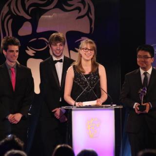 Tommy Hoffmann and his teammates accept their award onstage at the BAFTA ceremony.  