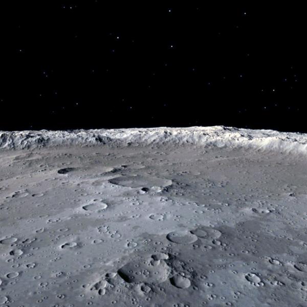 The surface of the moon, with empty space in the background