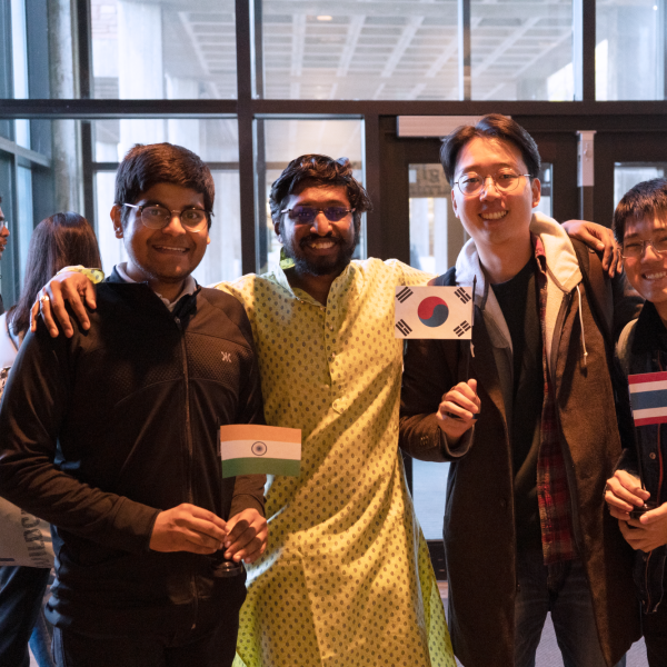 Students hold flags at the CS Cross cultural celebration