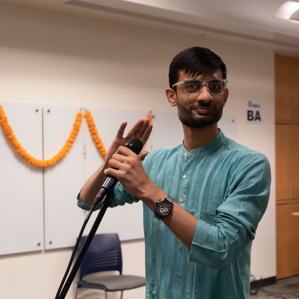 Student tests a mic at the CS Cross cultural celebration