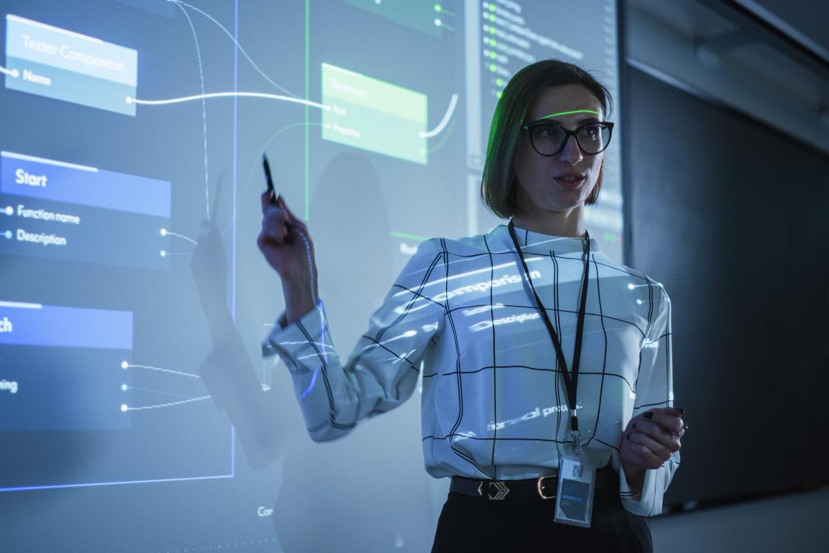 A woman gives a presentation on AI in her workplace