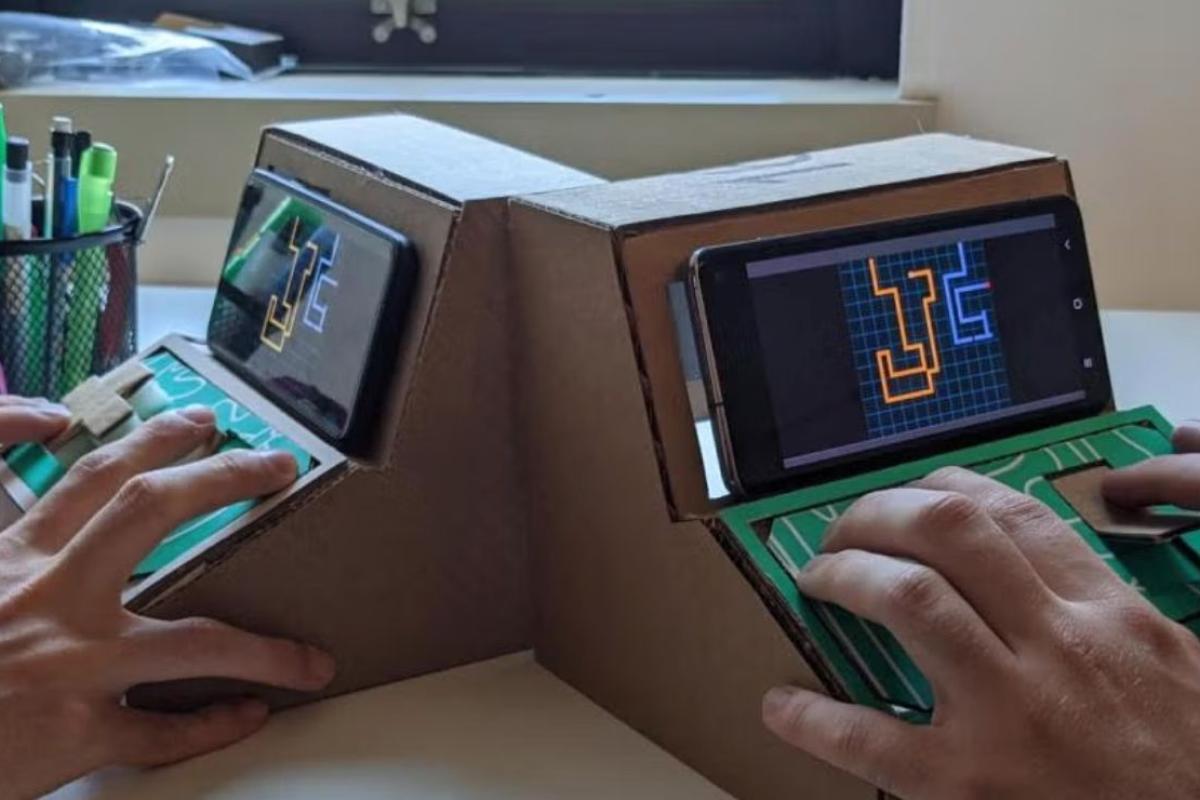 people working on arcade games