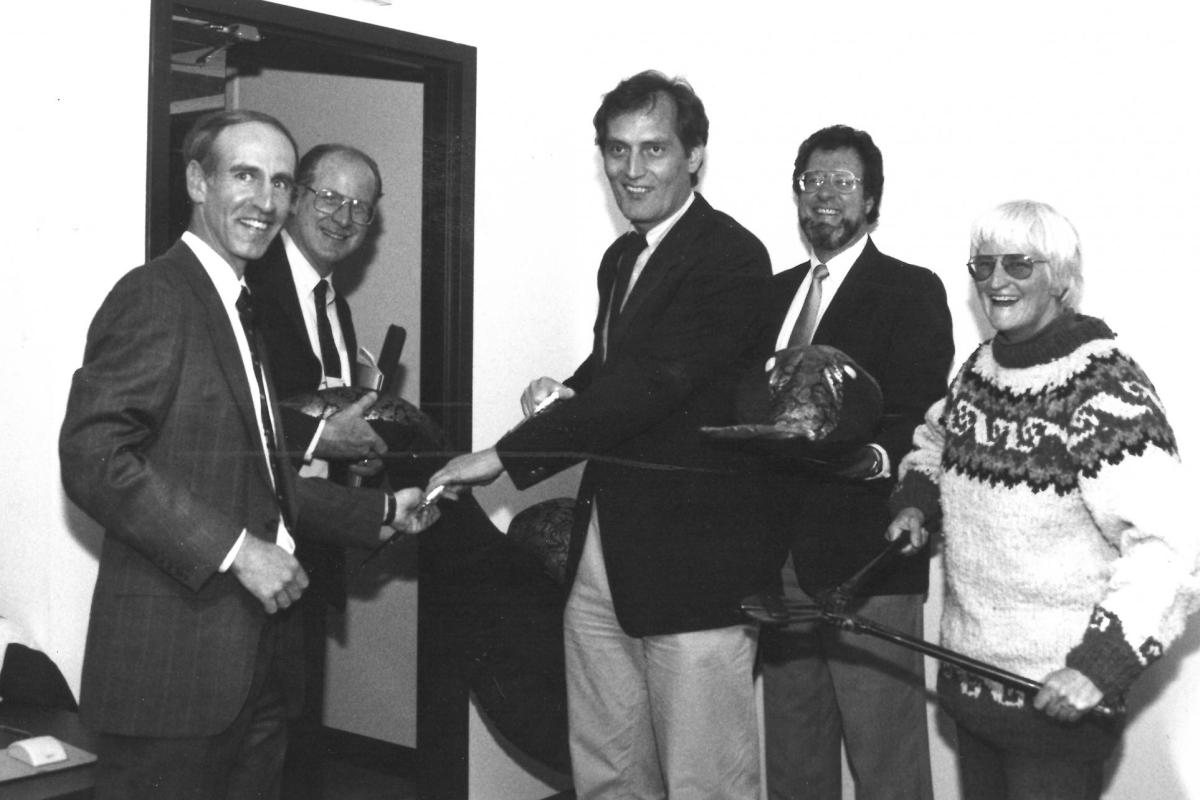Bobby Schnabel, Karl Winklmann and Evi Nemeth have some fun during a ribbon-cutting ceremony featuring a giant stuffed snake.