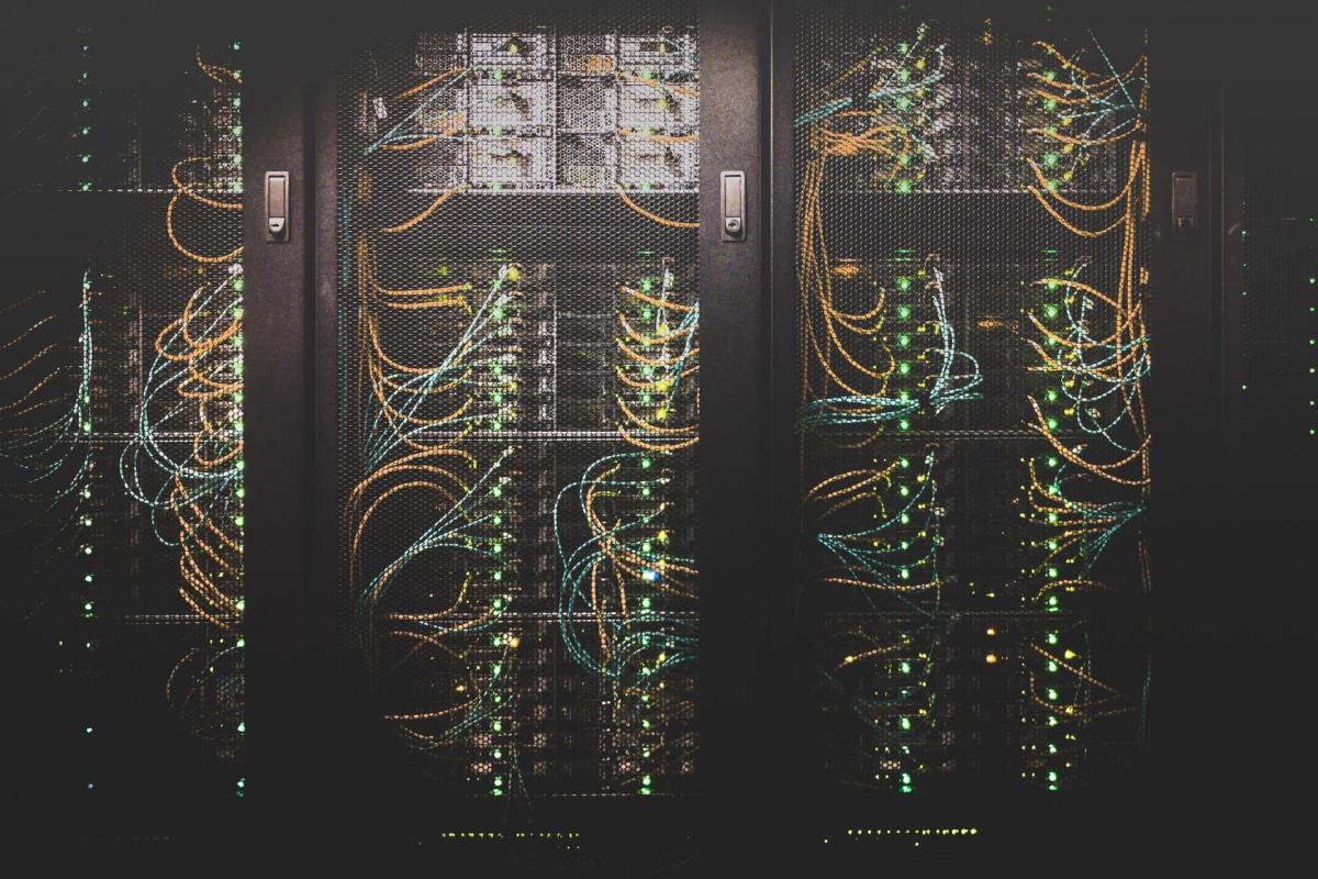 Lockers containing stacked servers and cables