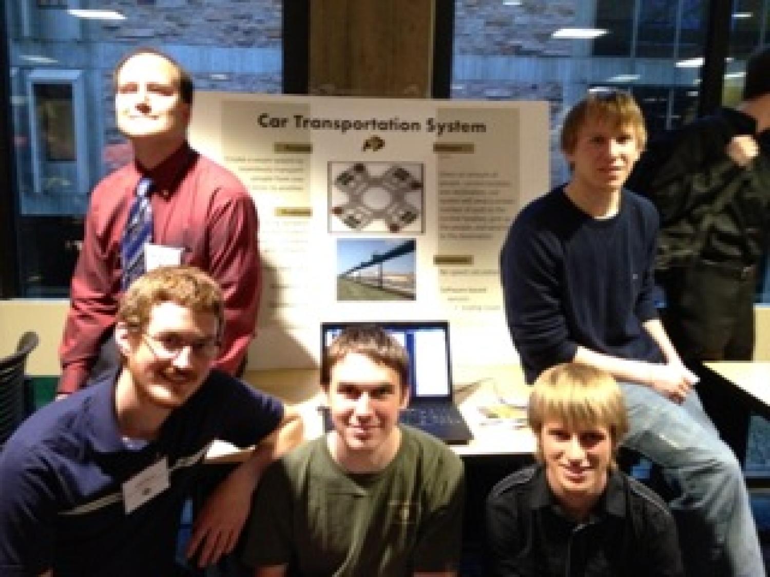 The team with their poster at the senior projects expo.