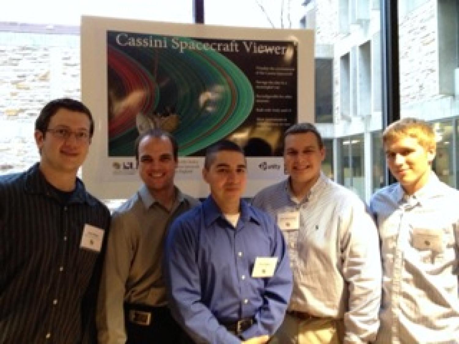The team members with their poster at the senior design expo.