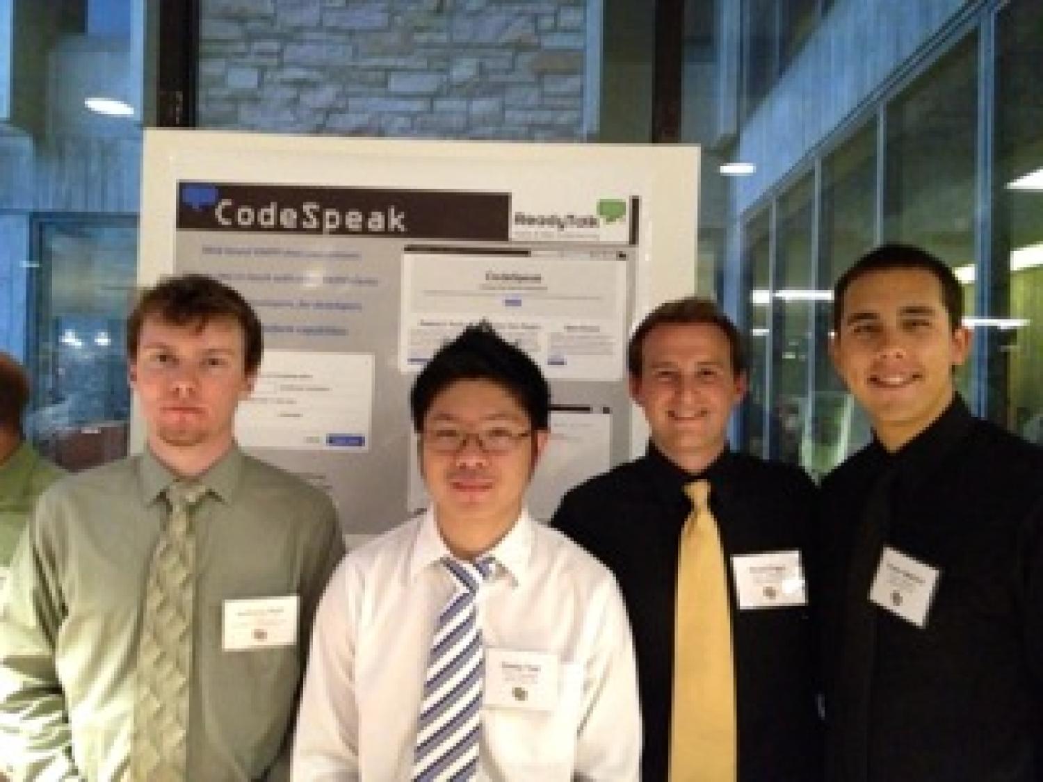 The team with their poster at the senior project expo.