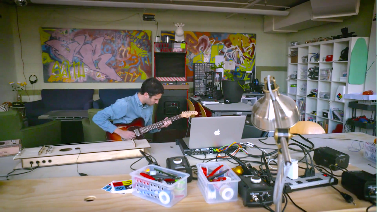 Willie Payne plays guitar in an ATLAS lab
