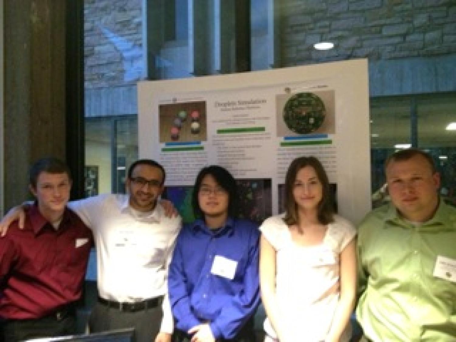 The team with their poster at the senior projects expo.
