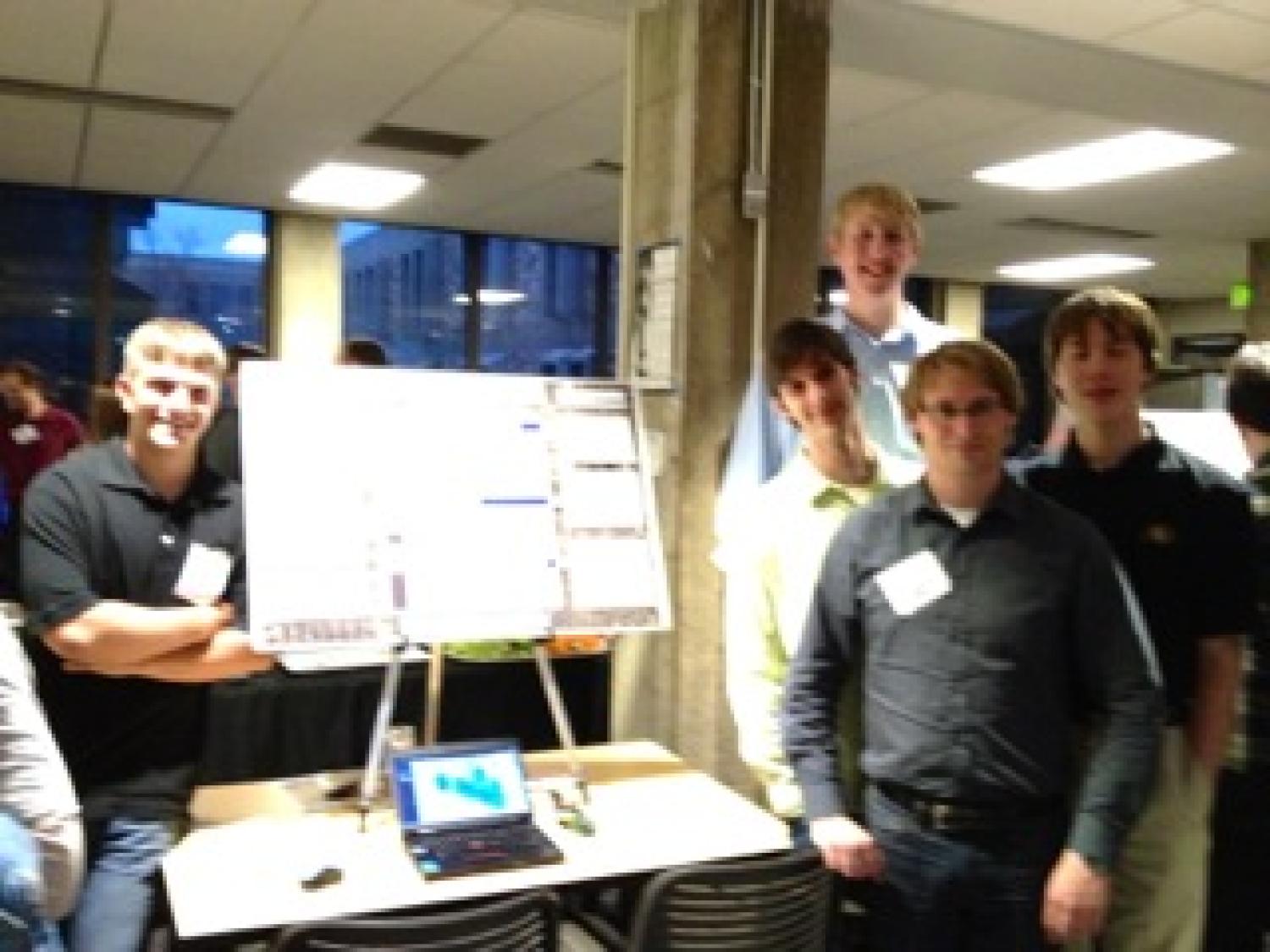The team with their poster at the senior projects expo.
