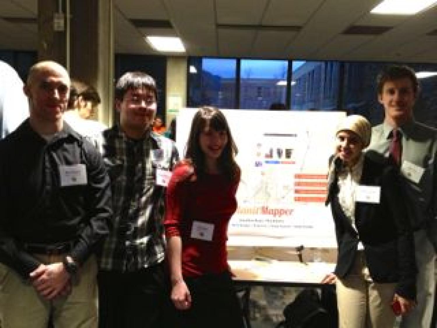 The team with their poster at the senior projects expo.
