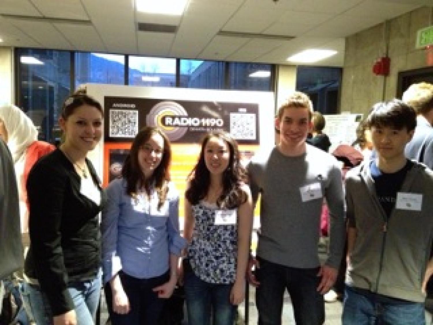 The team with their poster at the senior projects expo.