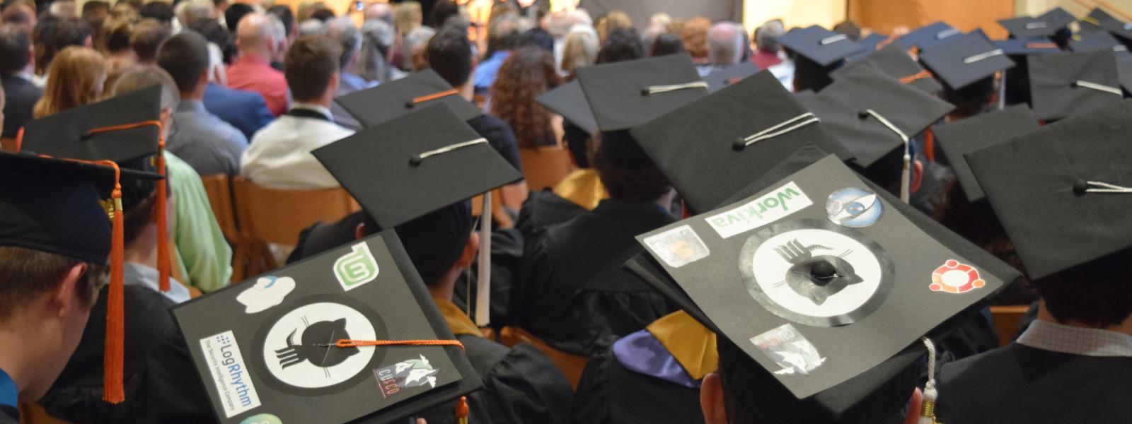 Decorated mortarboards at the 2016 Computer Science graduation ceremony.