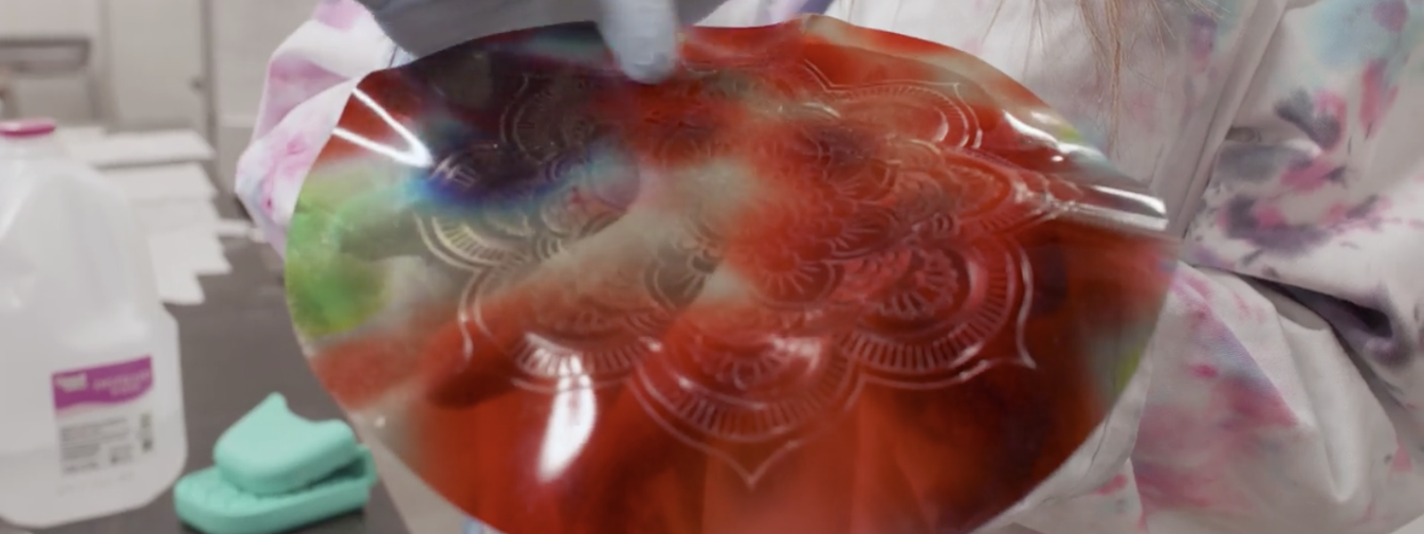 Hands holding imprinted gelatin