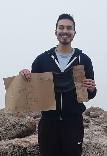 Matthew Strong on top of mountain