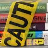 Banned books wrapped in caution tape
