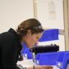 student looking through microscope in a lab