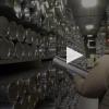 A scientist retrieves an ice core sample from a storage facility