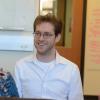 Aaron Clauset chats with a colleague