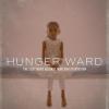 Hunger Ward Film Poster with an out-of-focus photo of a small child sitting on a bed