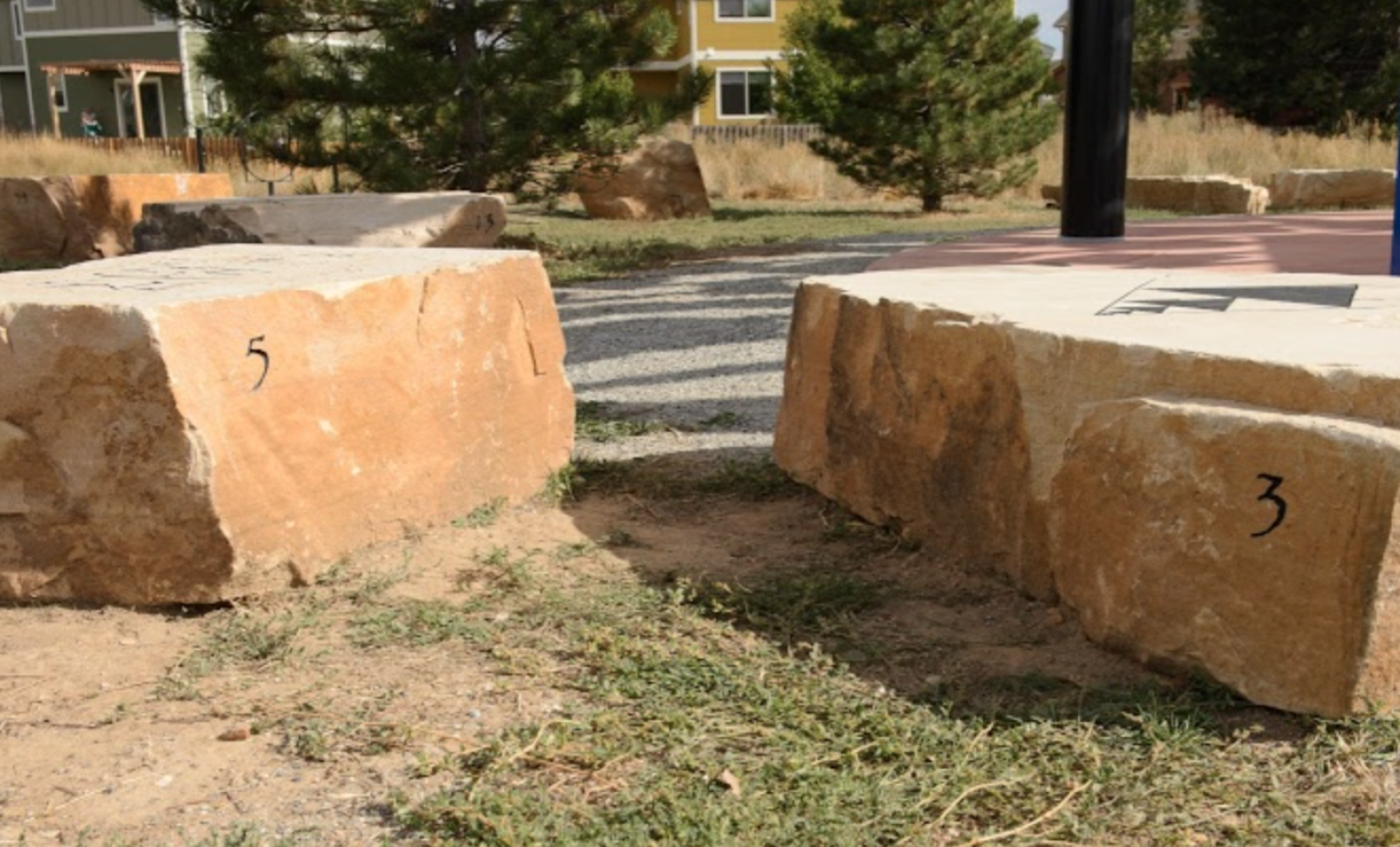 the numbers 3 and 5 on the sides of rocks