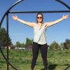 Woman standing behind sculpture of overlapping square and circle to showcase the relationships between various ratios