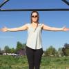 Woman standing behind sculpture of overlapping square and circle to showcase the relationships between various ratios