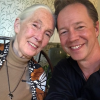 Jane Goodall and Bradley McLain sitting together and smiling.