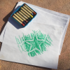 rubbing with green crayon