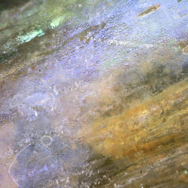 highly magnified detail of Roman glass showing