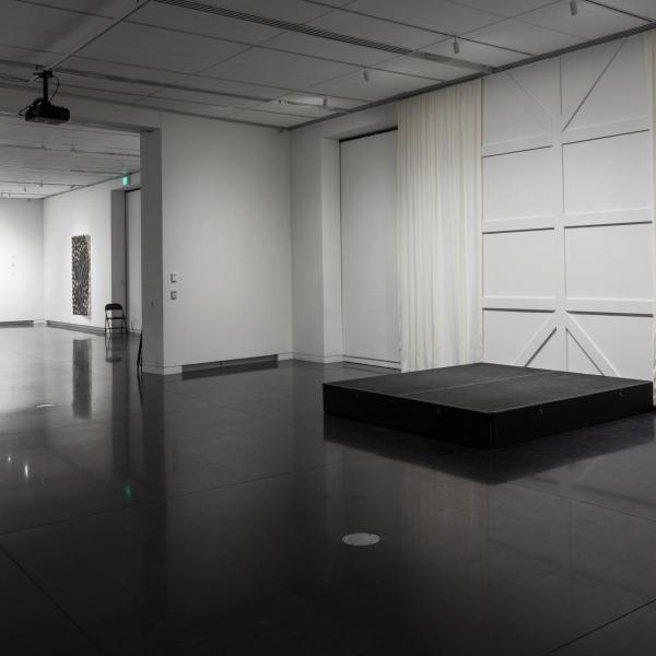 The stage on the southeast wall of the gallery
