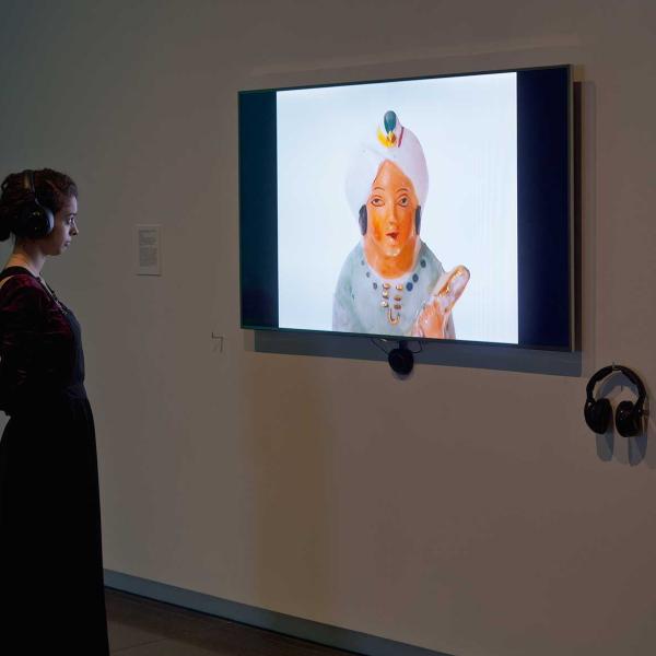 Woman watching a video on a screen