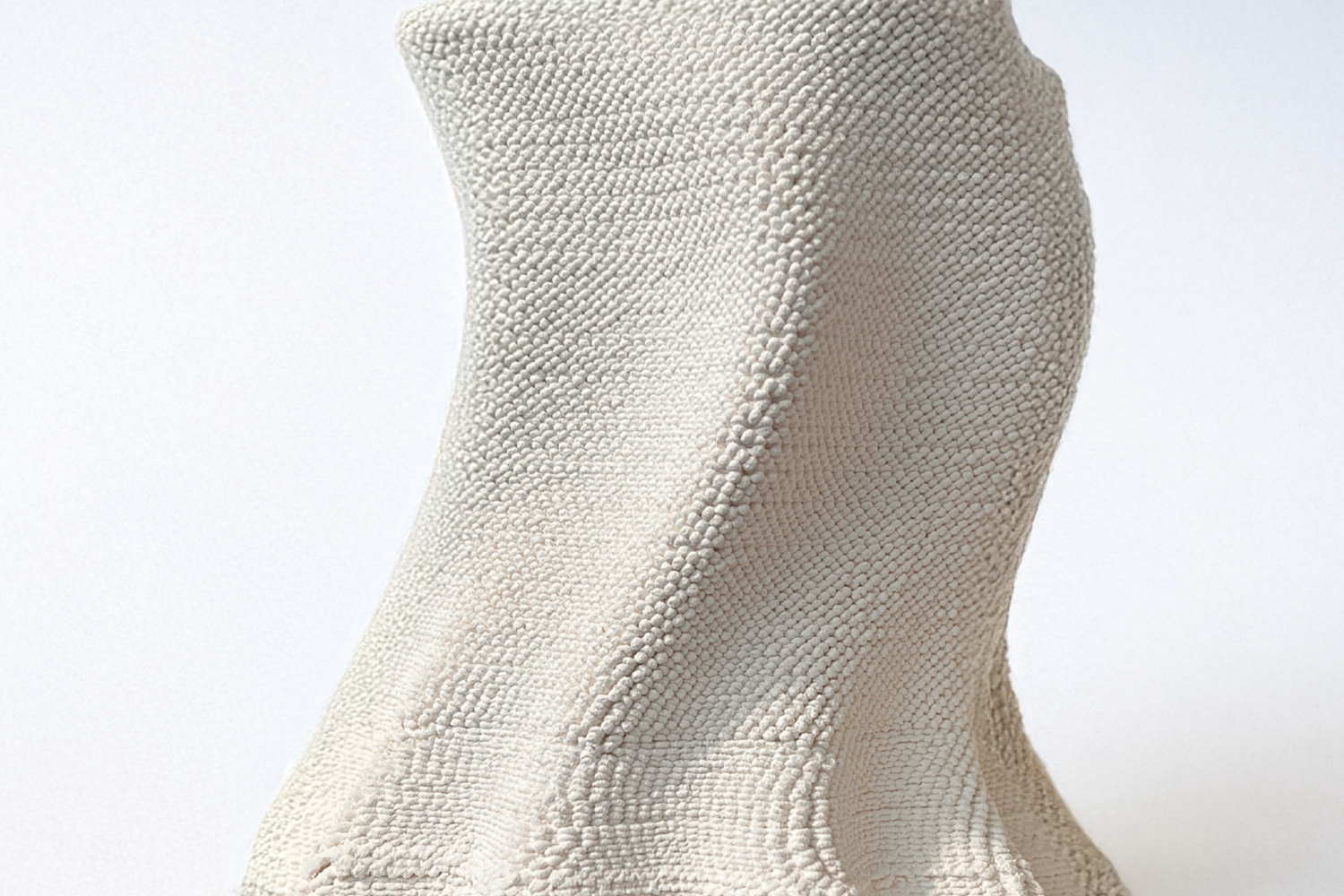 Close up of a white sculpture.