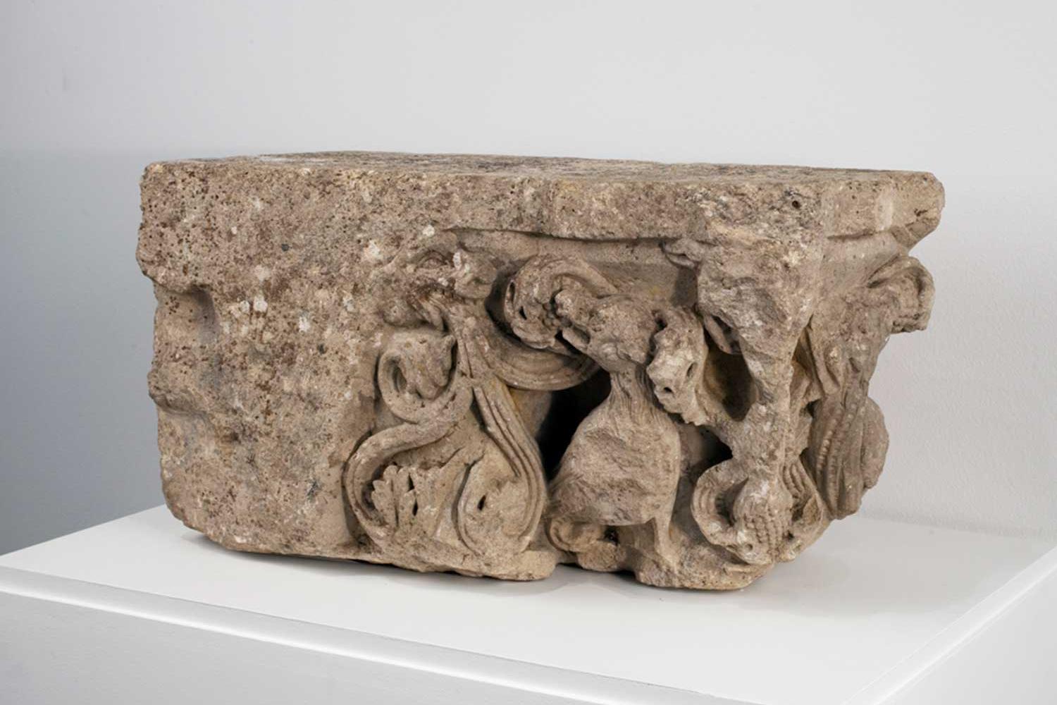 a carved stone architectural element from a medieval structure